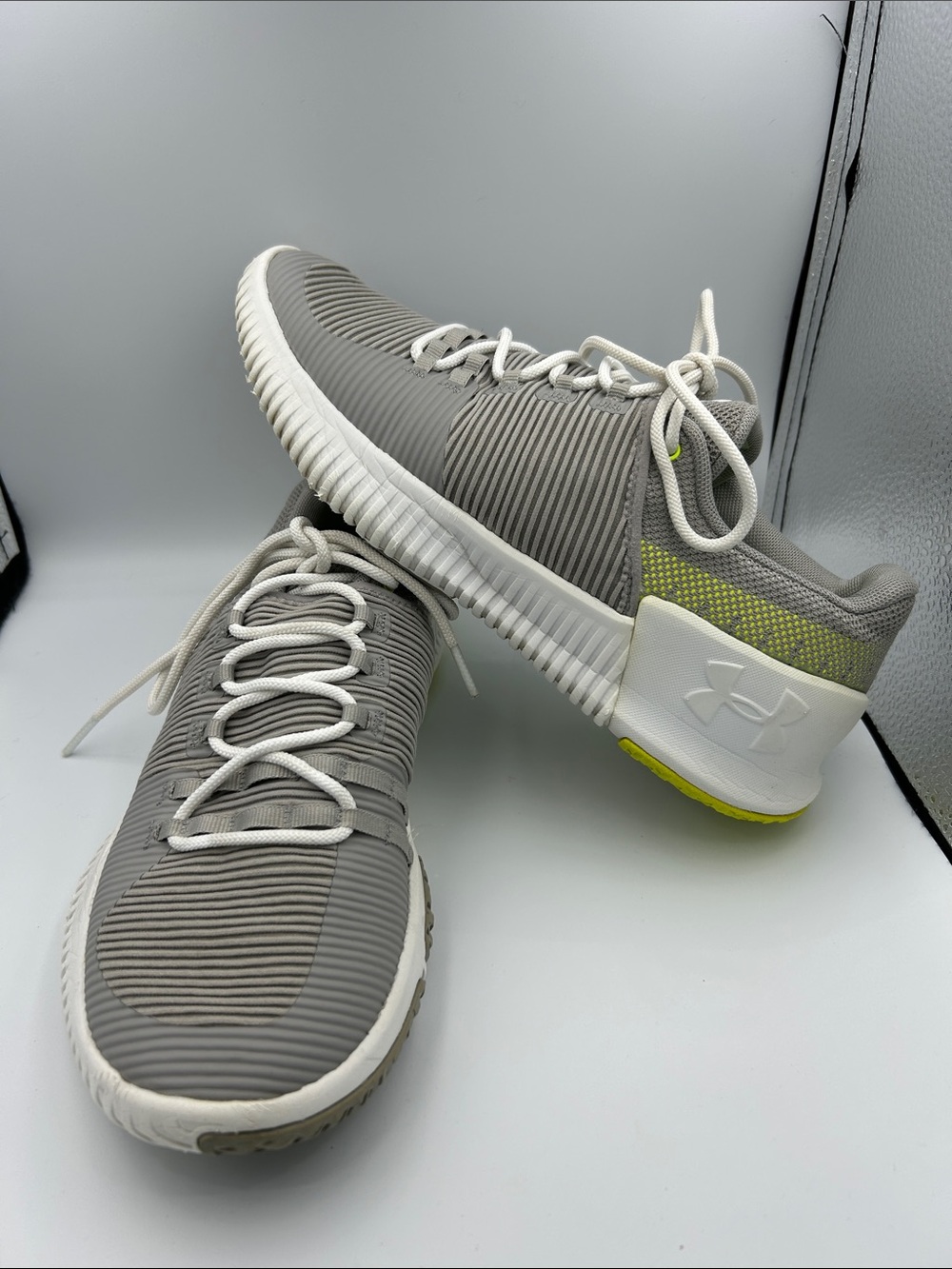 Under Armour Gray and White Men's Athletic Training Shoes with Yellow Accent